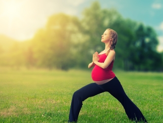 healthy-pregnant-woman-doing-yoga-in-nature-26378148